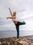 Outdoor ballet practice. Attractive Caucasian woman practicing ballet pose. Young ballerina is dancing and posing. Slim body.