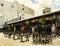 Outdoor bar at teenage market in Bangkok with antique petrol pumps