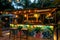 Outdoor bar with tropical themed decor. Vacation night life concept. Generative AI