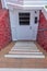 Outdoor basement entrance in the middle of red concrete walls at San Francisco, California