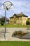 Outdoor basketball equipment and old schoolhouse