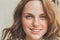 Outdoor beauty. Portrait of smiling young and happy woman with freckles.