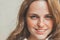 Outdoor beauty. Portrait of smiling young and happy woman with freckles.