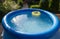 Outdoor blue inflatable pool with water