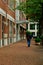 Outdoor brick sidewalk with pedestrians