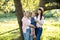 Outdoor bright portrait of happy cheerful multi generation family, smiling grandmother, young mother and little cute 3