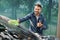 Outdoor car wash with sponge and foam. Car washing. Smiling bearded man showing thumb up, cleaning his car windscreen