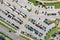 Outdoor carpark with rows of cars. aerial top view in sunny day