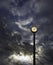 Outdoor clock and cloudy sky