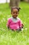 Outdoor close up portrait of a cute little young black girl - Af