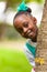 Outdoor close up portrait of a cute young black girl - African p