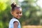 Outdoor close up portrait of a cute young black girl - African p