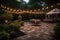 outdoor dance floor illuminated by lanterns and string lights in garden setting