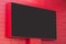 Outdoor digital display on red wall