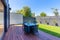 Outdoor dining table on wooden deck in a suburban home back yard in Australia.