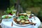 Outdoor dinner with grilled fish salad and coal roasted potatoes