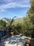 Outdoor eating area with sunny mountain landscape