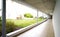 Outdoor empty corridor with garden in the modern office building