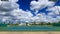 Outdoor empty tennis court with blue sky and cloud