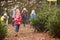 Outdoor Family Choosing Christmas Tree Together