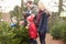 Outdoor Family Choosing Christmas Tree Together