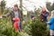 Outdoor Family Choosing Christmas Tree Together