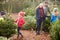 Outdoor Family Choosing Christmas Tree Together