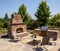 Outdoor fireplace and kitchen area Summer