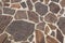 Outdoor flooring made with irregular porphyry slabs - Italy