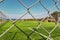 Outdoor Football Pitch Behind Fence With Sea