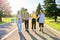 Outdoor, four teenagers walking together on road