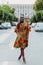 Outdoor full fashion portrait of fashionable black woman skin