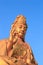 Outdoor golden color Buddha figure closeup day view