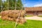 Outdoor hay drying construction near old barn