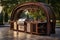 Outdoor Kitchen With Grill and Sink, Front view of an outdoor BBQ area with an arched gazebo, stainless steel BBQ, ornate wooden