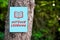 Outdoor learning sign with an arrow written on paper on a tree in the forest. Outdoor education