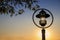 Outdoor lights lanterns, bollards in illuminating a walkway in the garden at sunset