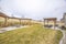 Outdoor living spaces and playground at the spacious and grassy yard of a home