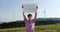 Outdoor of men activist with Save forest ecology poster. In background forest and wind turbine