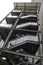 Outdoor metal black emergency staircase outside a building