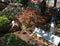 Outdoor model train track with train station lighthouse and barn