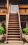 Outdoor old wooden stairs with staircase railing