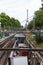 An outdoor Paris metro rail station with a view of the Eiffel Tower