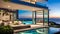 Outdoor patio and small pool in a modern residential building in the evening with lighting and ocean view,
