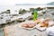 Outdoor picnic at the rocky beach with fresh pastry from local bakery, Slovenia typical food