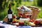 an outdoor picnic setup with wine and strawberries