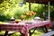 outdoor picnic table set for a barbecue meal