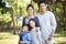 Outdoor portrait of asian family