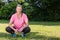 Outdoor Portrait of Attractive Middle Aged Woman Exercising