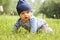 Outdoor portrait of a baby on all fours. crawling on knees child on grass in a summer park